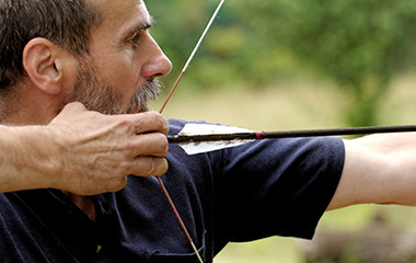 Man Using Archery Supplies and Aiming Crossbow Outside - 2-15